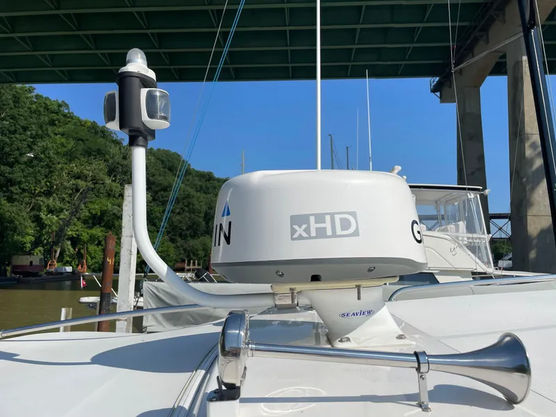 Slide: The Image of 2017 Riviera 3600 Sport Yacht with radar and horn under a bridge. - 46