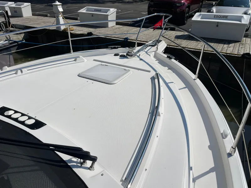 Slide: The Image of 2017 Riviera 3600 Sport Yacht docked, showcasing sleek deck design and modern features. - 47