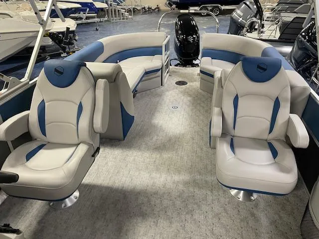 Slide: The Image of 2025 South Bay LE boat dashboard with steering wheel and control panel. - 6