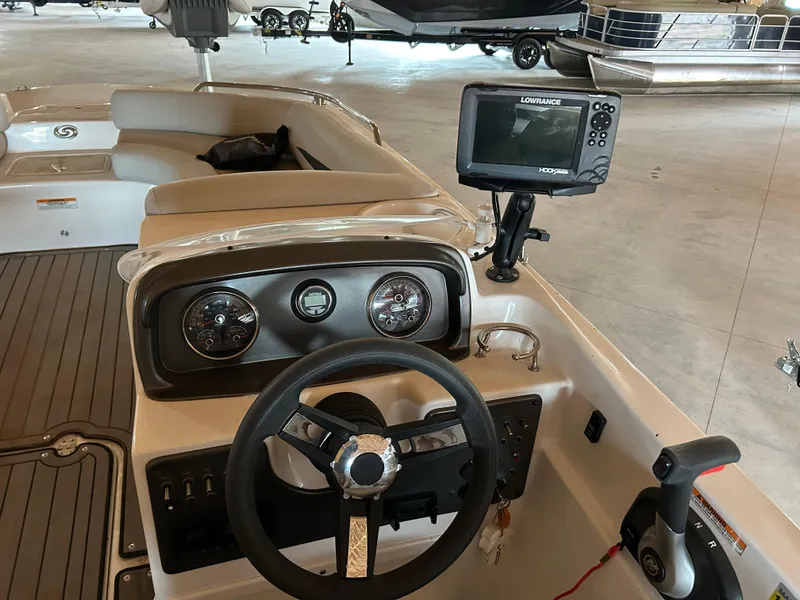 Slide: The Image of Interior of 2022 Hurricane SS 201 boat with steering wheel and navigation system. - 2