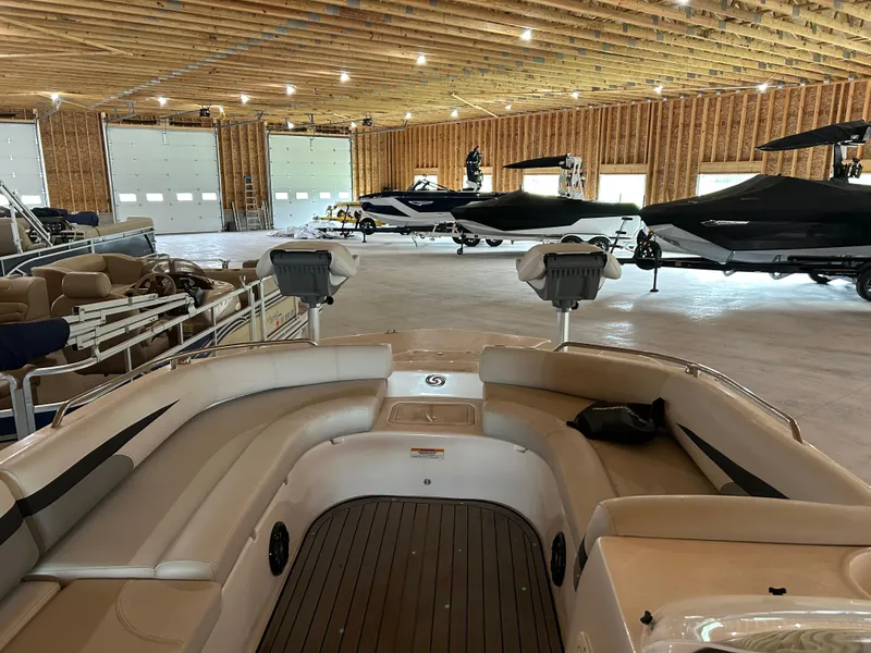 Slide: The Image of Indoor storage of 2022 Hurricane SS 201 boats in a spacious warehouse. - 4