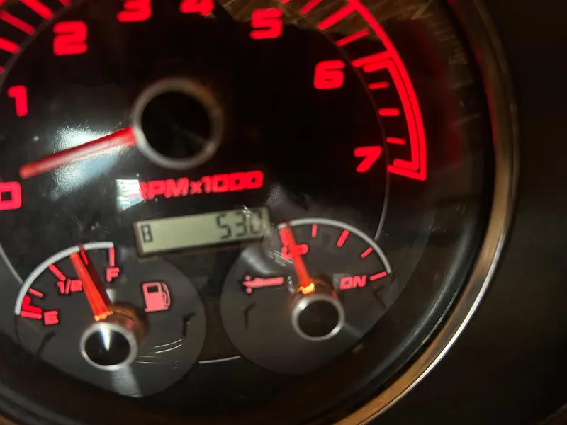 Slide: The Image of Close-up of 2022 Hurricane SS 201 dashboard showing RPM and fuel gauges. - 5