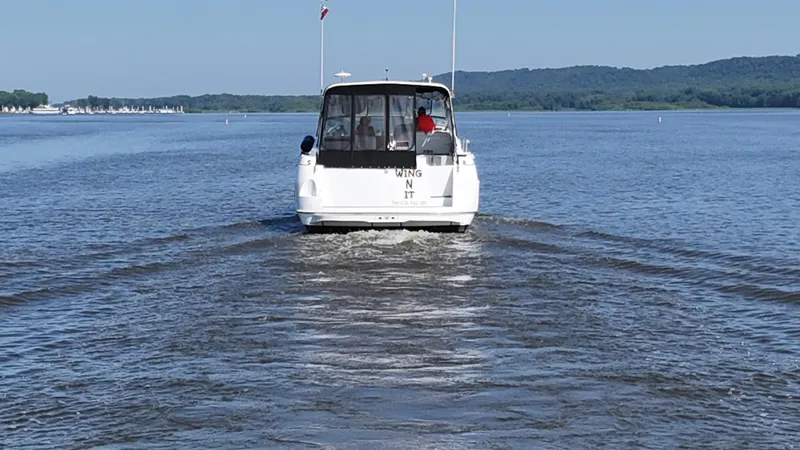 Slide: The Image of 1998 Cruisers Yachts 3575 Esprit cruising on a calm lake with scenic background. - 13