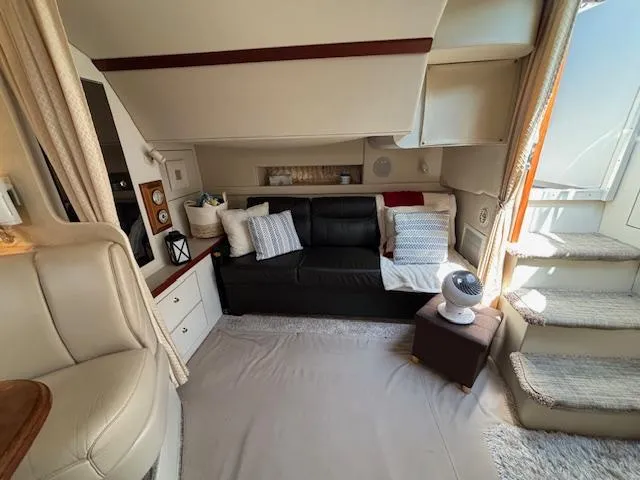 Slide: The Image of Interior of 1998 Cruisers Yachts 3575 Express, featuring cozy seating and modern decor. - 8