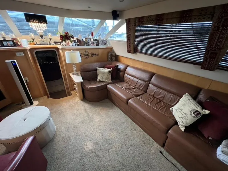 Slide: The Image of Luxurious interior of 1998 Carver 455 Aft Cabin Motoryacht with leather seating and elegant decor. - 10
