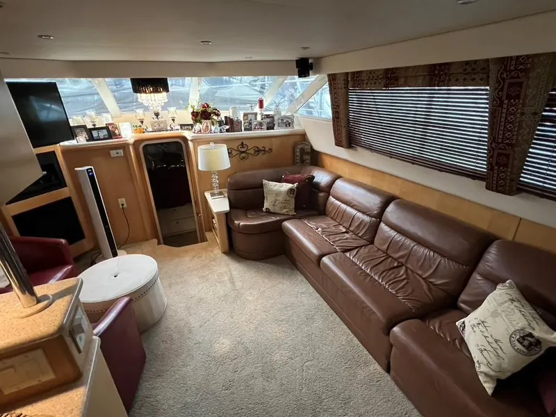 Slide: The Image of Luxurious interior of 1998 Carver 455 Aft Cabin Motoryacht with leather seating and elegant decor. - 13