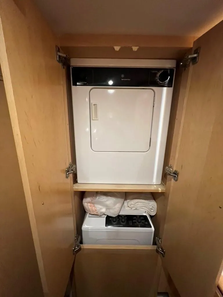 Slide: The Image of Laundry appliances in a 1998 Carver 455 Aft Cabin Motoryacht cabinet. - 22