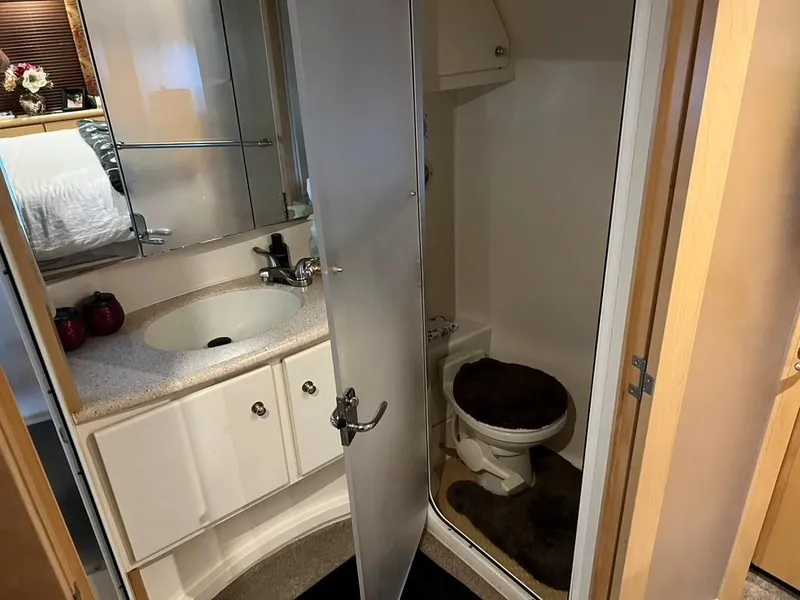 Slide: The Image of Bathroom interior of 1998 Carver 455 Aft Cabin Motoryacht with sink and toilet. - 27