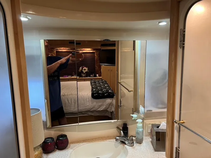 Slide: The Image of Interior of 1998 Carver 455 Aft Cabin Motoryacht bathroom with mirror and sink. - 28