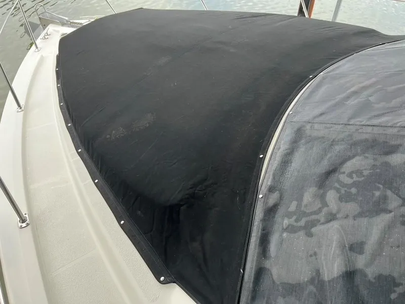 Slide: The Image of 1998 Carver 455 Aft Cabin Motoryacht with black canvas cover on deck. - 37