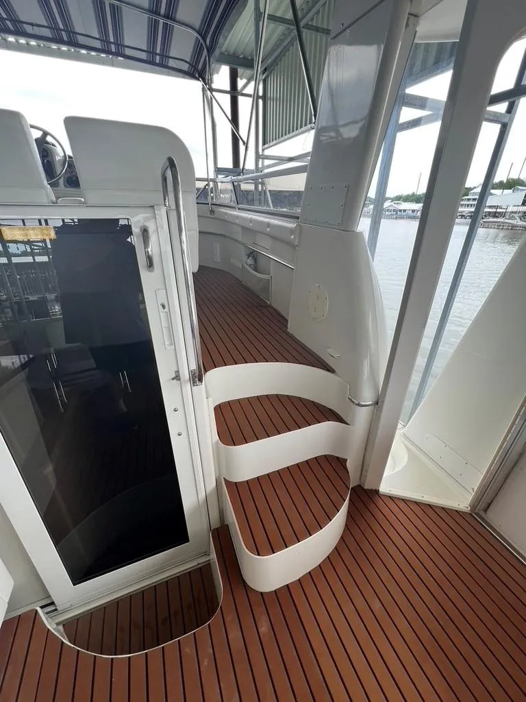 Slide: The Image of 1998 Carver 455 Aft Cabin Motoryacht with wooden deck and curved stairs. - 43