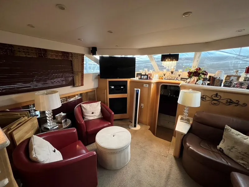 Slide: The Image of Luxurious interior of 1998 Carver 455 Aft Cabin Motoryacht with elegant seating and decor. - 9