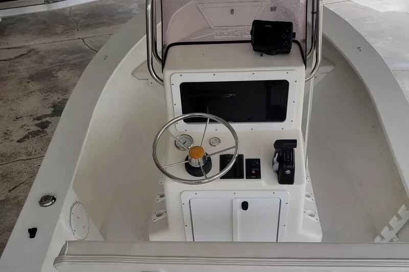 Slide: The Image of 2021 May-Craft 1800 Center Console boat interior with steering wheel and controls. - 3