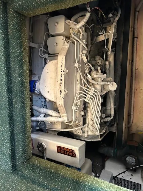 Slide: The Image of Engine compartment of a 2001 Nordic Tug 32, showcasing intricate mechanical components. - 15