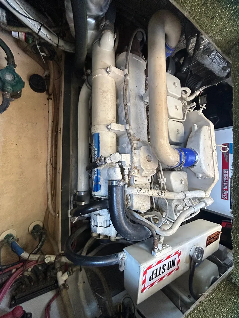 Slide: The Image of Engine compartment of a 2001 Nordic Tug 32, featuring detailed mechanical components. - 36