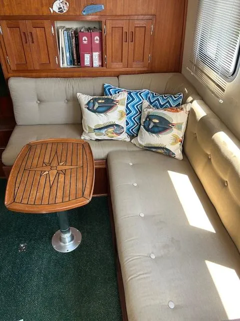 Slide: The Image of Interior of 2001 Nordic Tug 32 with cozy seating and decorative pillows. - 4