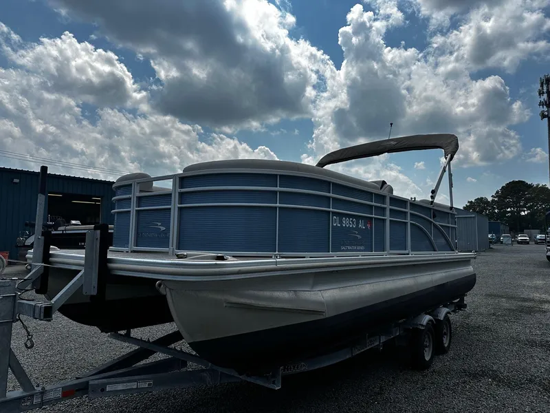 The Image of 2019 Bennington SSRX Pontoon 22 on trailer under cloudy sky. - 0