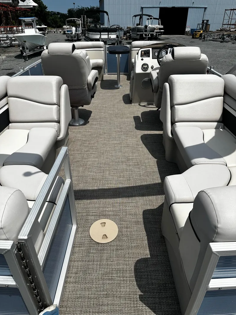 Slide: The Image of 2019 Bennington SSRX Pontoon 22 interior with plush seating and modern dashboard. - 16