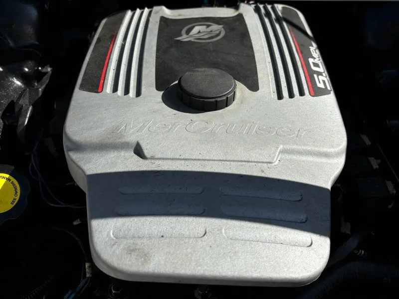Slide: The Image of Engine of 2010 Sea Ray 210 Select boat, featuring MerCruiser branding. - 10