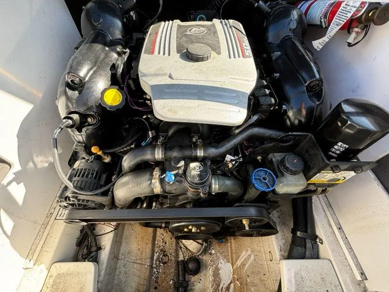 Slide: The Image of Engine of a 2010 Sea Ray 210 Select boat, detailed view. - 11