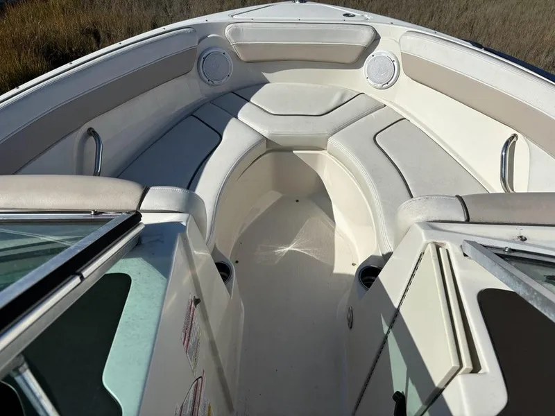 Slide: The Image of Interior view of 2010 Sea Ray 210 Select boat with cushioned seating. - 2