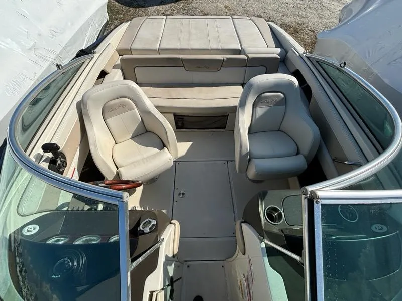 Slide: The Image of 2010 Sea Ray 210 Select boat interior with seating and dashboard view. - 5