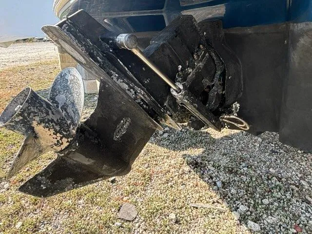 Slide: The Image of 2010 Sea Ray 210 Select boat propeller and stern drive on gravel surface. - 9