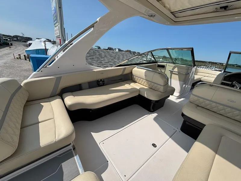 Slide: The Image of 2020 Regal 2800 Bowrider interior with beige seating and open deck layout. - 11