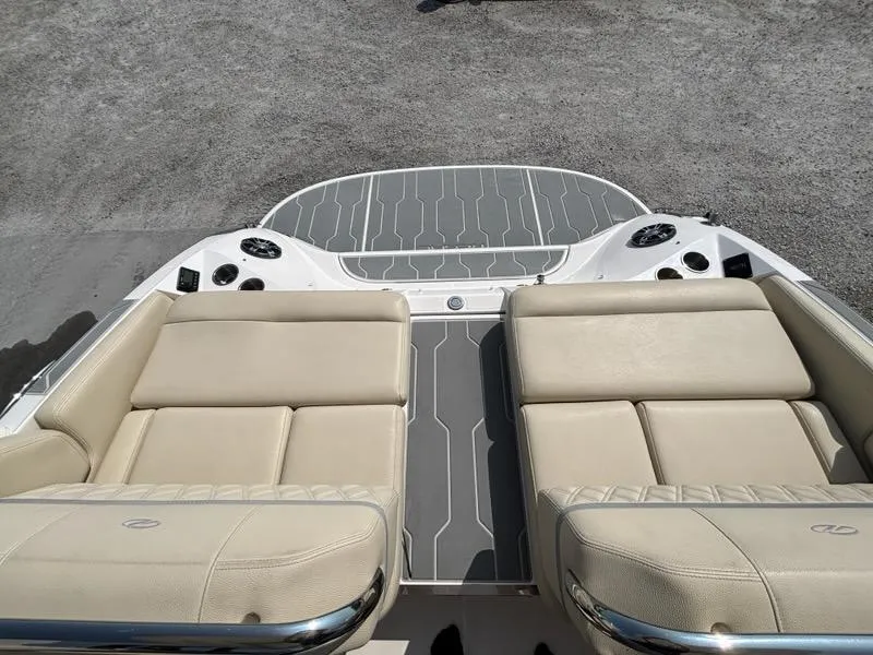 Slide: The Image of 2020 Regal 2800 Bowrider boat with beige seating and gray deck. - 16