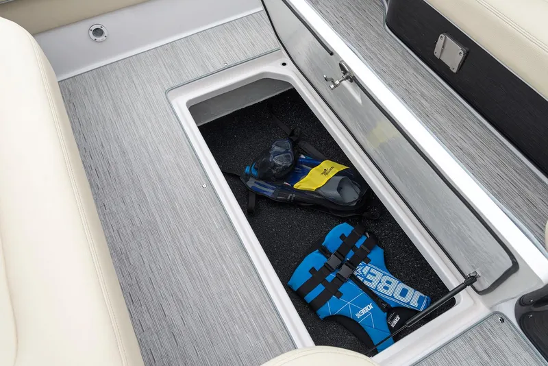 Slide: The Image of Manufacturer Provided Image: 2020 Regal 2800 Bowrider storage compartment with life jackets and snorkeling gear. - 23