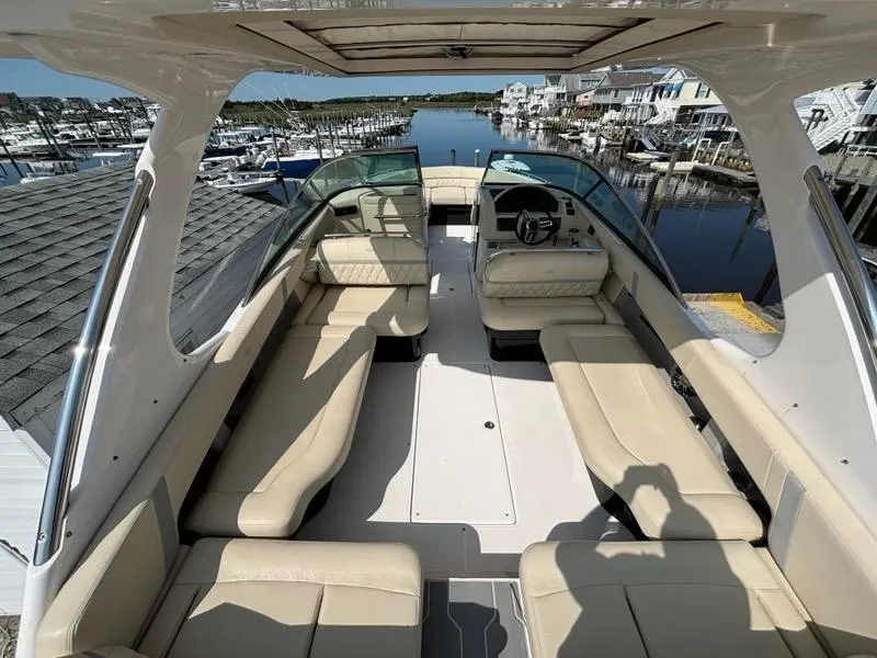Slide: The Image of 2020 Regal 2800 Bowrider with spacious seating, docked at a marina. - 8