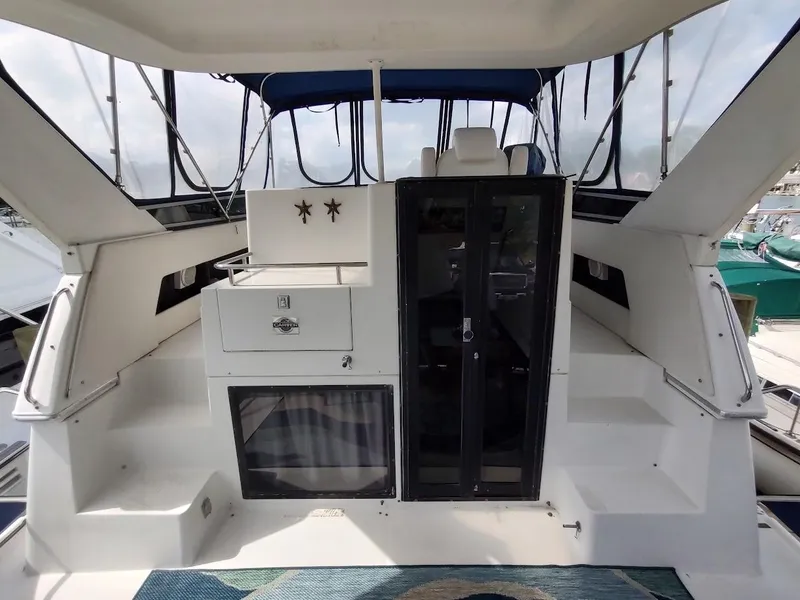 Slide: The Image of 1992 Carver 36 Aft Cabin yacht interior with seating and storage. - 14