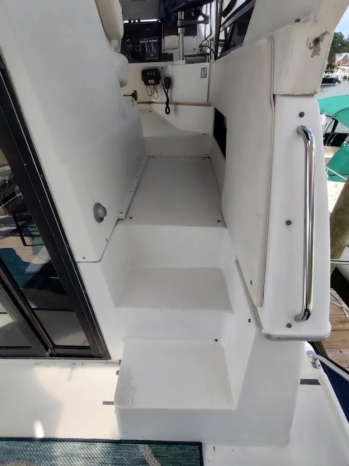 Slide: The Image of 1992 Carver 36 Aft Cabin boat interior with steps and railing. - 15