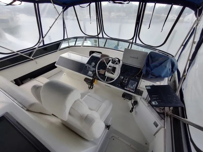 Slide: The Image of Interior helm of 1992 Carver 36 Aft Cabin yacht with steering wheel and navigation equipment. - 18
