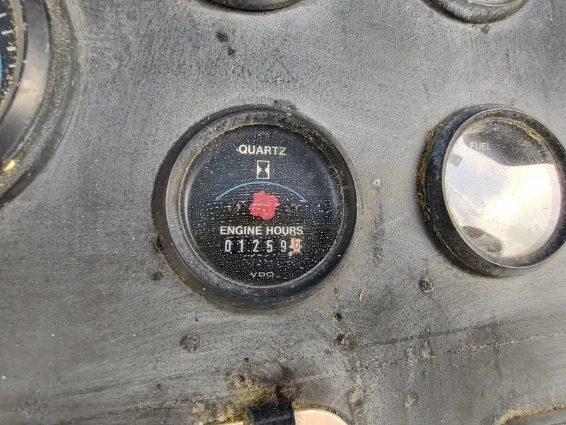 Slide: The Image of Close-up of a 1992 Carver 36 Aft Cabin engine hour meter showing 1259 hours. - 23