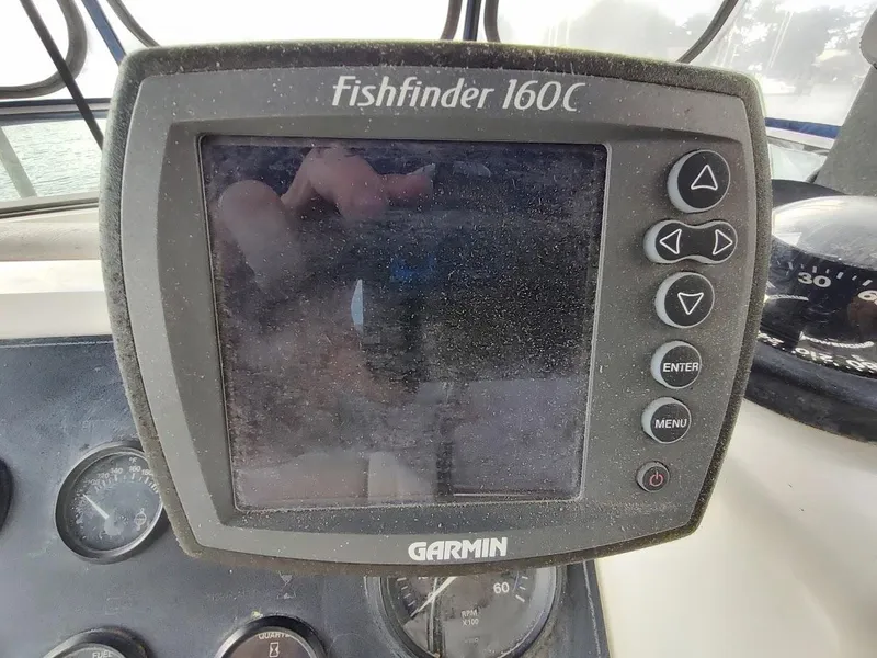 Slide: The Image of Garmin Fishfinder 160C on 1992 Carver 36 Aft Cabin boat dashboard. - 26