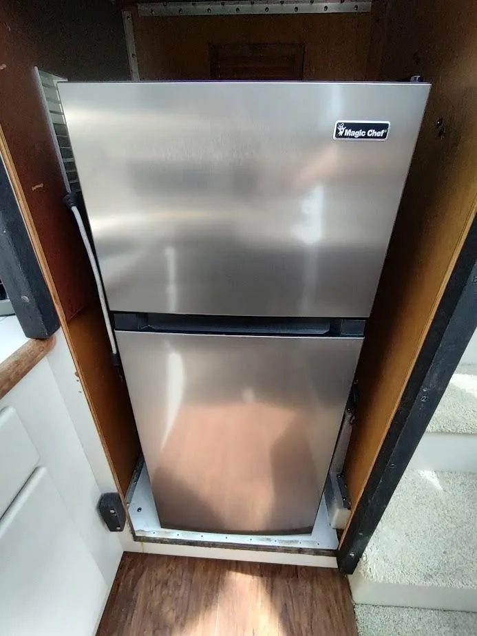 Slide: The Image of Magic Chef refrigerator inside 1992 Carver 36 Aft Cabin yacht kitchen. - 41