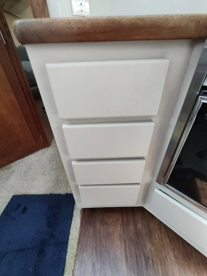 Slide: The Image of Interior of 1992 Carver 36 Aft Cabin showing kitchen drawers and flooring. - 46