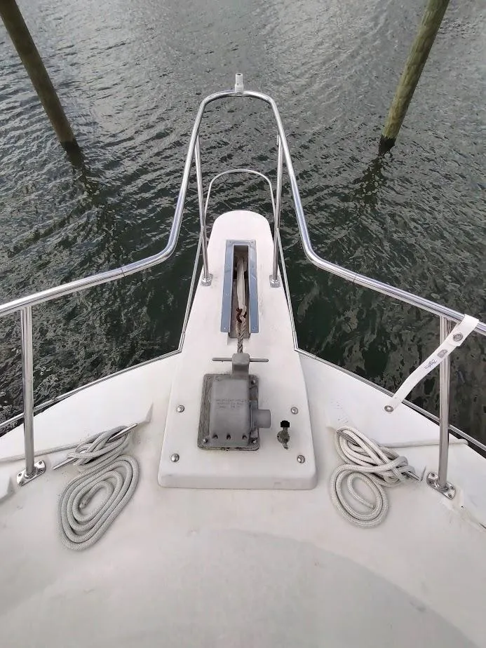 Slide: The Image of Bow of 1992 Carver 36 Aft Cabin yacht with anchor and ropes. - 7