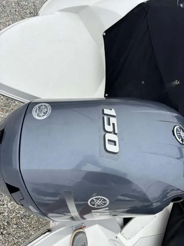 Slide: The Image of Yamaha 150 outboard motor on a 2018 Stingray 214 LR boat. - 22