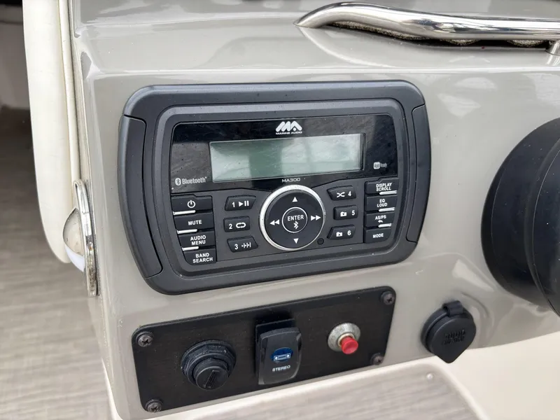 Slide: The Image of Boat audio system on 2018 Stingray 214 LR dashboard with Bluetooth connectivity. - 25