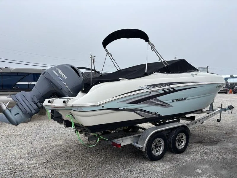 Slide: The Image of 2018 Stingray 214 LR boat on trailer with Yamaha outboard motor. - 5