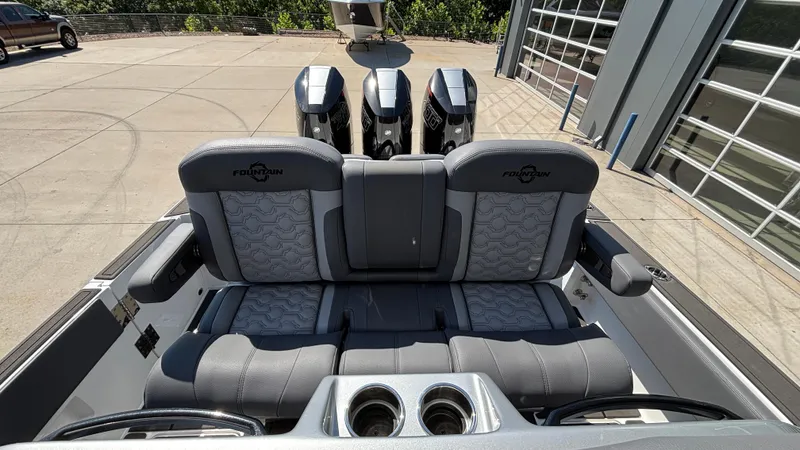 Slide: The Image of 2025 Fountain 34 SC boat interior with triple engines and luxurious seating. - 10