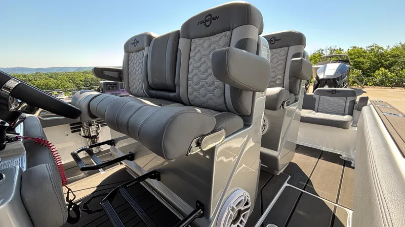 Slide: The Image of 2025 Fountain 34 SC boat interior with luxurious gray seating and modern design. - 12