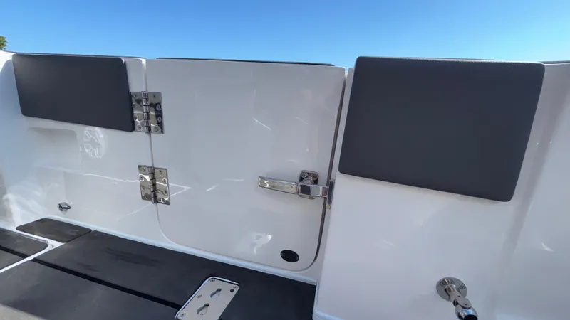 Slide: The Image of 2025 Fountain 34 SC boat interior, featuring sleek white panels and modern hardware. - 19