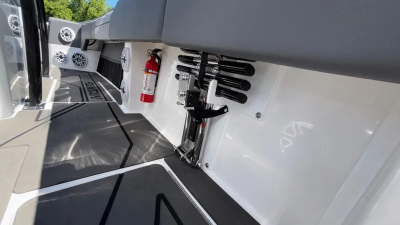 Slide: The Image of Interior of 2025 Fountain 34 SC boat with fire extinguisher and rod holders. - 29