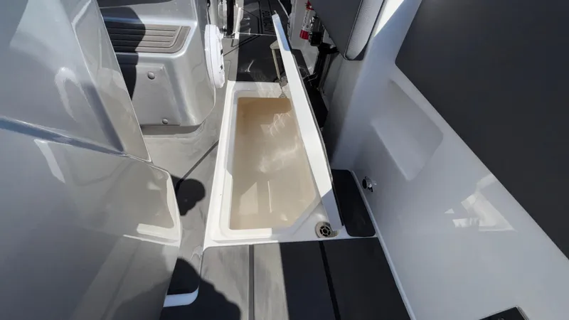 Slide: The Image of 2025 Fountain 34 SC boat interior with open storage compartment. - 30