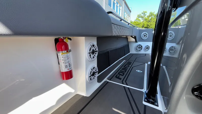 Slide: The Image of Interior of 2025 Fountain 34 SC boat with speakers and fire extinguisher. - 35