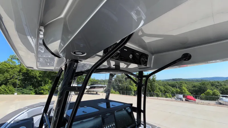 Slide: The Image of 2025 Fountain 34 SC boat interior with advanced dashboard and sleek design. - 37