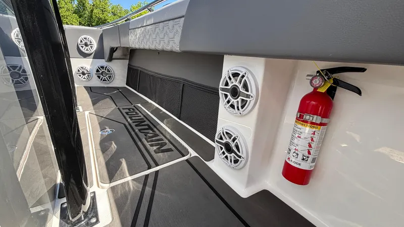 Slide: The Image of Interior of 2025 Fountain 34 SC boat with speakers and fire extinguisher. - 40